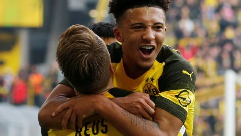 Sancho scores twice as leaders Dortmund held