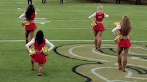 San Francisco 49ers cheerleader kneels for US anthem