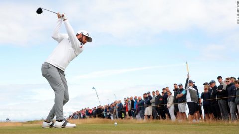 Cameron Young roars into lead on Open Championship debut as Tiger Woods struggles