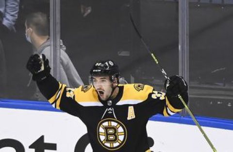 Bruins beat Hurricanes 4-3 in 2 OT in game delayed 15 hours