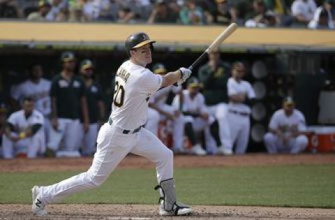 Canha hit in 11th, A’s edge KC 1-0 to hold wild card lead