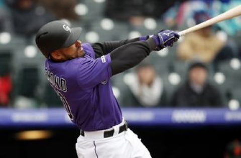 Rockies rally to beat Giants 12-11 at wintry Coors Field
