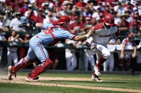 Arkansas pounds Ole Miss 14-1, earns return to CWS