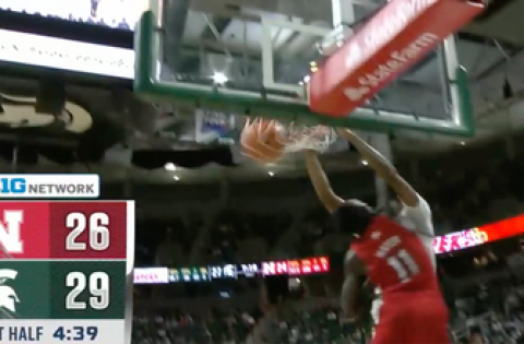 Marcus Bingham Jr. puts down a dunk over his defender as Michigan State increases its lead