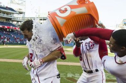 Phils lose for 1st time, Robinson forces in game-ending run