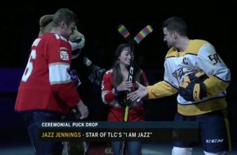 Panthers captain Aleksander Barkov and Predators captain Roman Josi exchange sticks with Jazz Jennings for Pride Night
