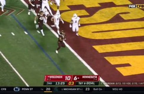 Ky Thomas rushes for a two-yard touchdown to give Minnesota a 13-10 lead over Wisconsin