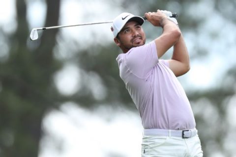 With bad back, Day tied for lead after 5-under 67