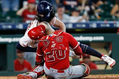 Angels’ Lucroy carted off after collision at plate