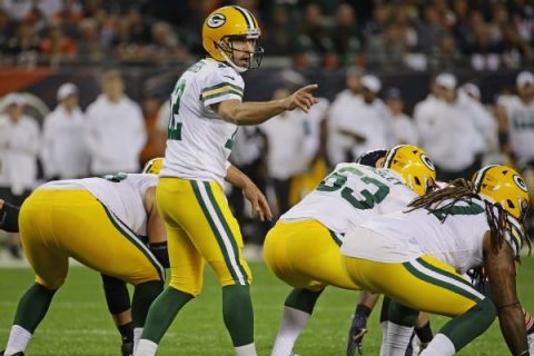 Double check: Rodgers tries wristband with plays