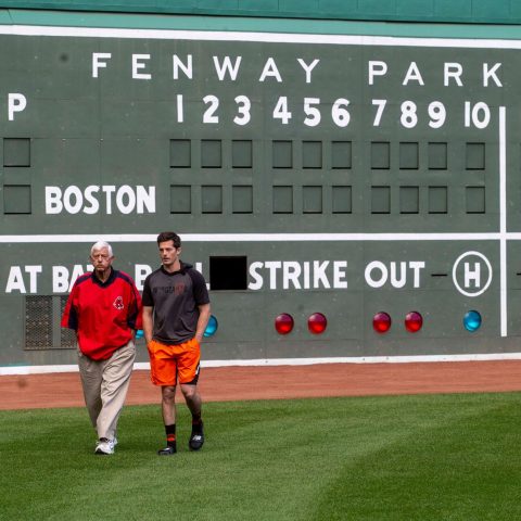 Hall of Famer Carl Yastrzemski walks the outfield at Fenway with his grandson Mike before the Red Sox face the Giants.
