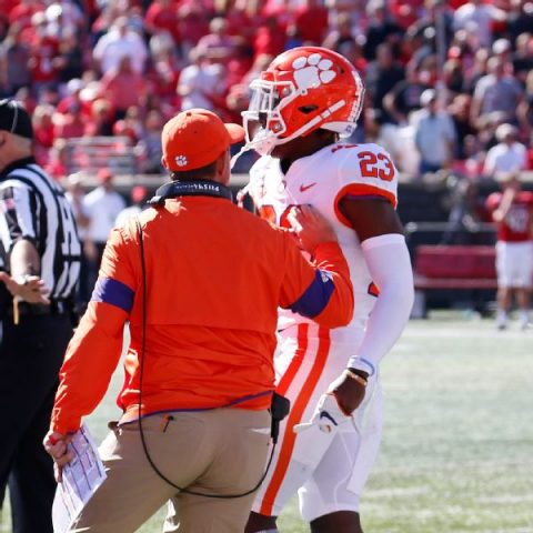 Clemson’s Booth rides bus after throwing punch