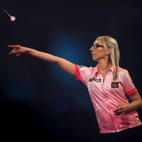 Female player makes darts history in London
