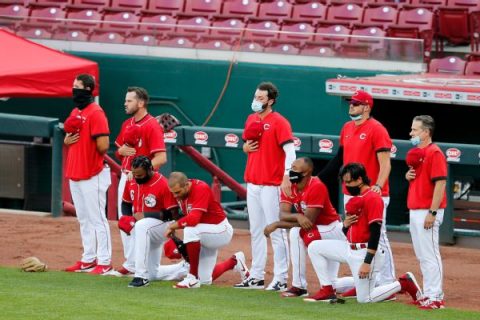 Votto among Reds players to kneel during anthem