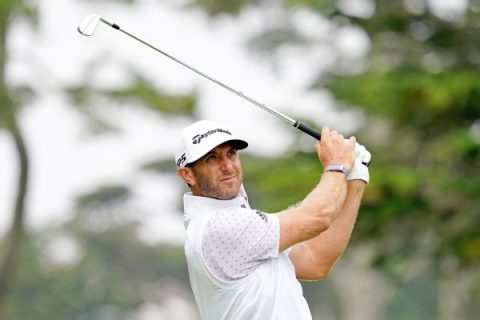DJ cools after hot start, takes Northern Trust lead