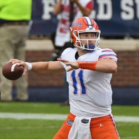 Florida’s Trask tosses 6 TDs to tie Burrow’s mark