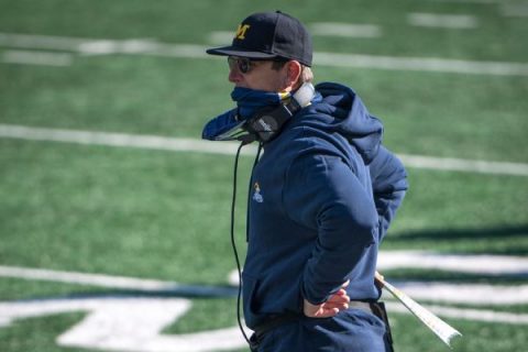 Harbaugh reaches extension to stay at Michigan