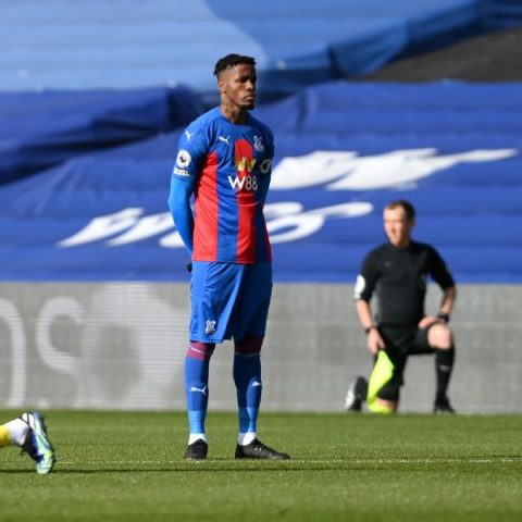 Zaha first PL player to not kneel before a match