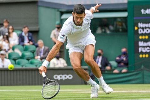 Federer routed at Wimbledon; Djokovic to semis