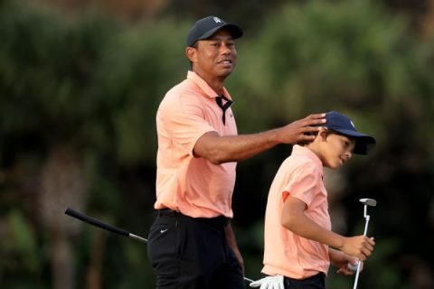 Tiger shoots scramble 62 with son in return