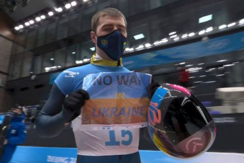 Ukrainian flashes ‘No War’ sign after skeleton run